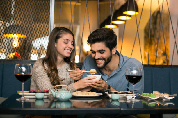 istock Couple eating dumplings 1196373318