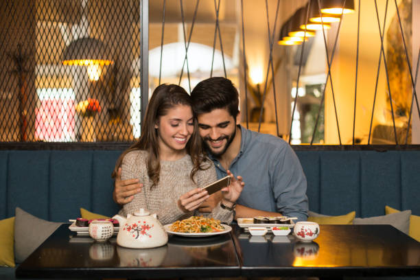 istock Couple having fun in a restaurant 1196373954