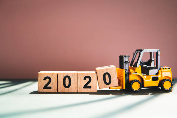 istock Miniature forklift lift up wooden block 1196376977