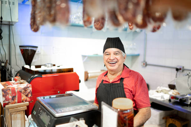istock Portrait of a happy butcher working 1196377123