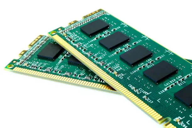 Photo of Two computer RAM Random Access Memory on a white background. The concept of fast work technology, progress, acceleration. Selective focus. Is isolated.