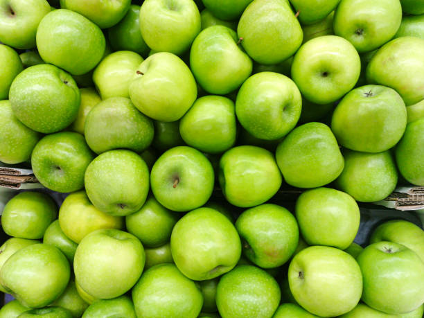 istock Background of green apples 1196379183