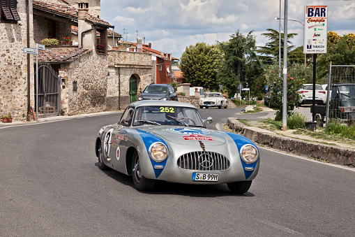 the former Formula 1 driver Jochen Mass and Michael Schroeder on Mercedes Benz 300 SL W 194 Carrera (1952) in classic car race Mille Miglia, on May 17, 2014 in Colle di Val d'Elsa, Tuscany, Italy