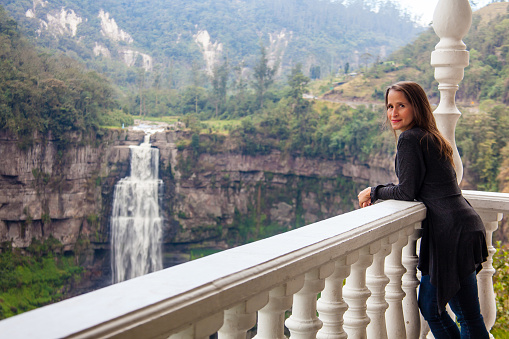 Female tourist visiting the famous Tequendama Falls located southwest of Bogotá in the municipality of Soacha
