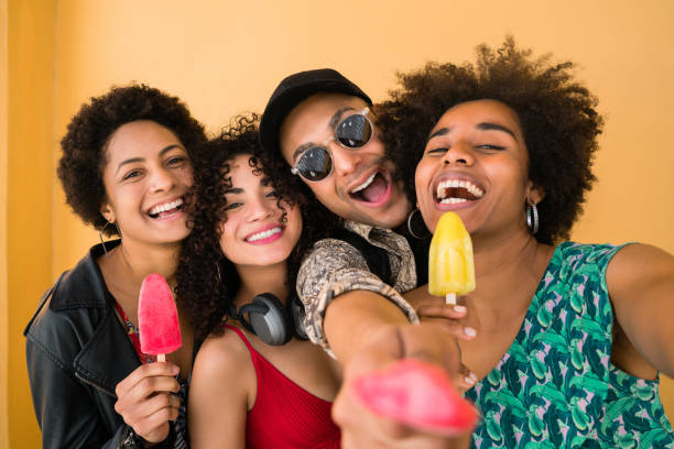 istock Multi-ethnic group of friends enjoying summertime while eating ice cream. 1196385142