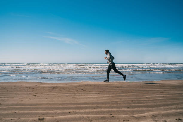 istock Portrait of an athletic man running. 1196385151
