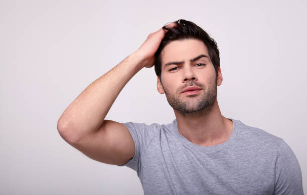 istock A male model poses on a light background. 1196385228