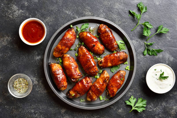 istock Bacon wrapped grilled chicken wings 1196388586