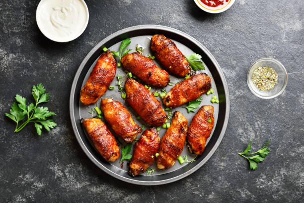 istock Bacon wrapped grilled chicken wings 1196388595