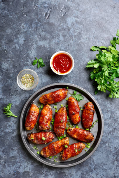 istock Bacon wrapped grilled chicken wings 1196388596