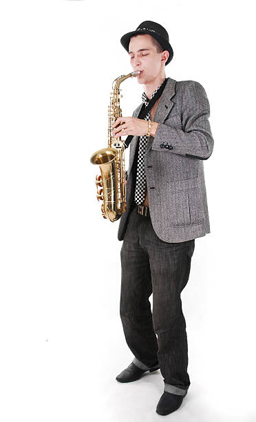 istock A young man playing a saxophone on a white background 119639036