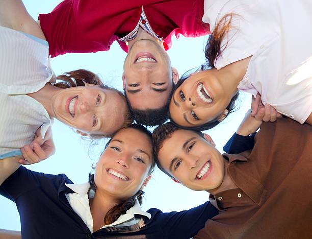 istock friends happy group in circle heads from below 119639081