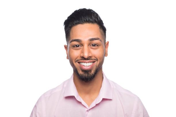 Portrait of a happy young man of asian ethnic descent Portrait of a happy young man photographed in a studio in front of a white background formal portrait photos stock pictures, royalty-free photos & images