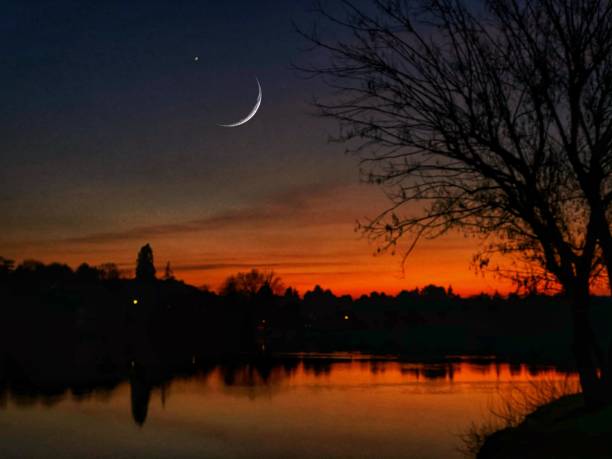 istock Sunset with big moon 1196392169