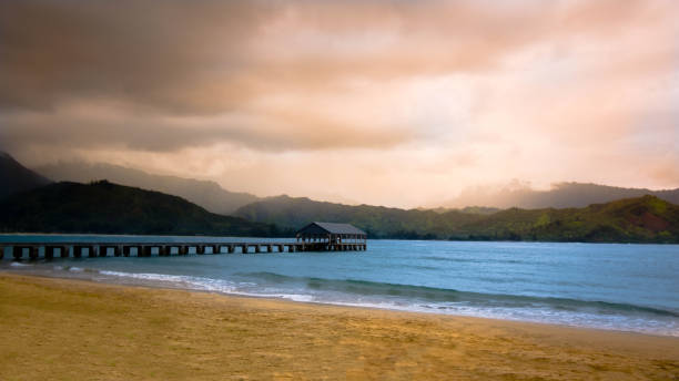 Jetty in a bay in Hawaii Steg in Hanalei Bay auf Hawaii hanalei bay stock pictures, royalty-free photos & images