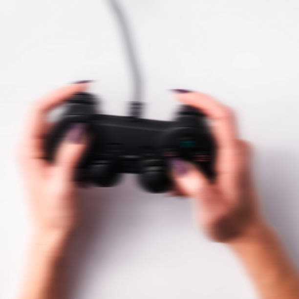 istock Joystick in female hands 1196397618