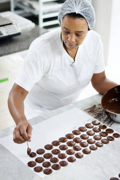 istock Woman preparing chocolate in a factory 1196399921
