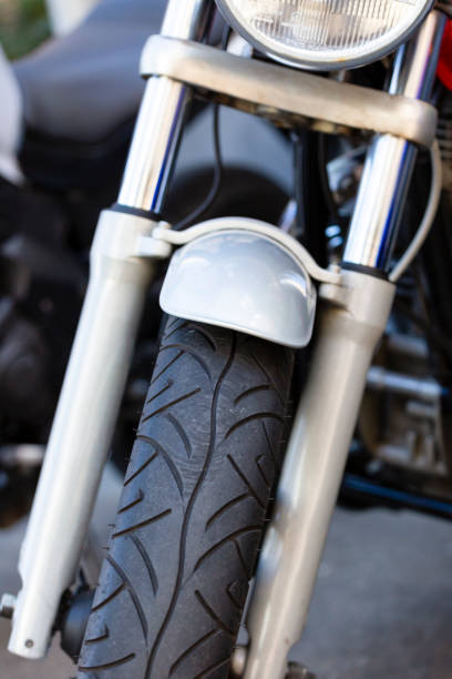 istock Closeup front view of motorcycle wheel, background with copy space 1196400562