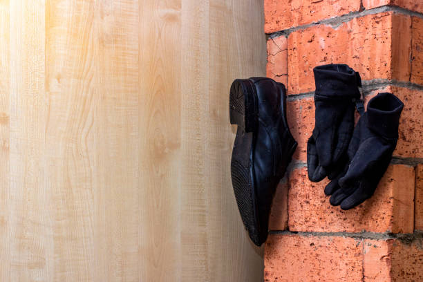 istock drying leather boots on the chimney from getting wet feet 1196400571