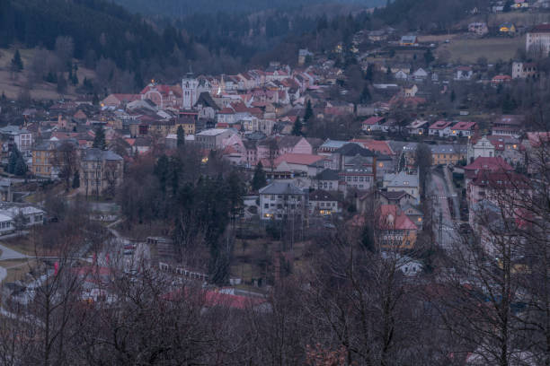 View over Vimperk town in winter dark cold evening in centre of national park Sumava