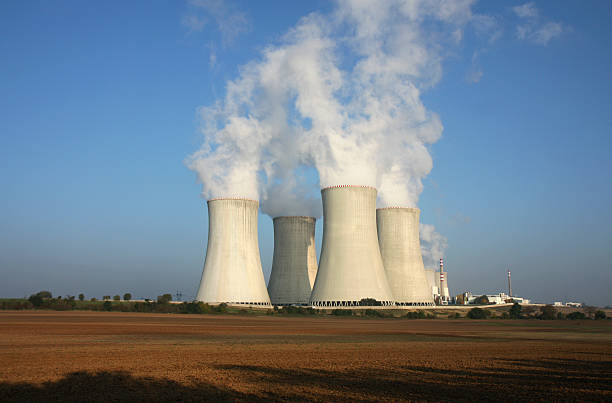 nuclear power plant and agriculture field stock photo