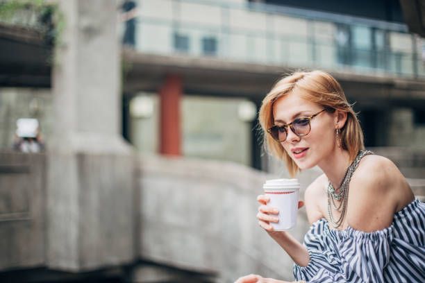 istock Woman with coffee 1196403726