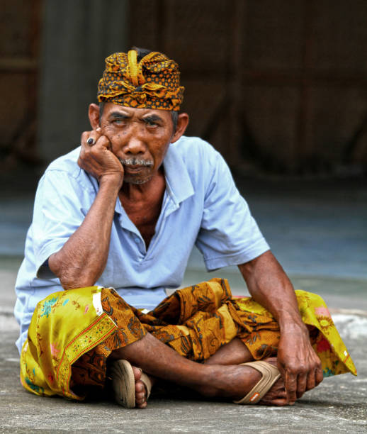 Ketewel, Bali, Indonesia - 19th September 2010. Men of the village gather before the temple religious ceremony.