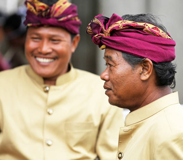 Ketewel, Bali, Indonesia - 19th September 2010. Men of the village gather before the temple religious ceremony.