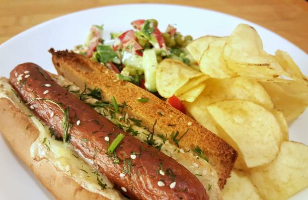 istock Grilled sausages with cheese salad and potatoes 1196410802