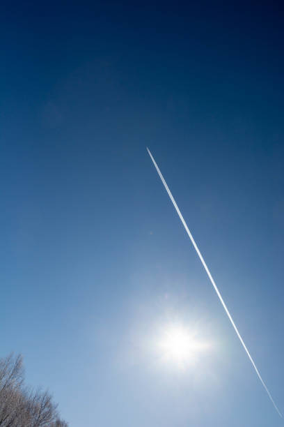 istock Blue sky and contrail in winter 1196414433