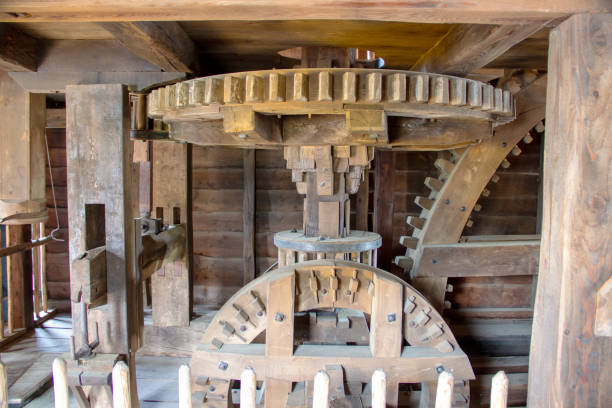 Interior view of the main shaft gears in a historic boat mill stock photo