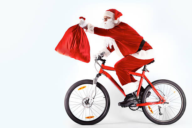 istock Santa on a bicycle holding out a sack 119641719
