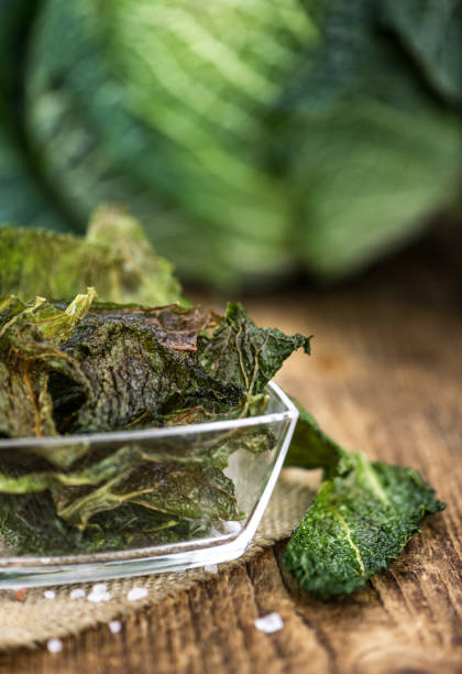 istock Some fresh Savoy Chips on wooden background (selective focus; close-up shot) 1196417763