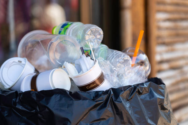 istock Paper coffee cup in the waste bin. 1196421982