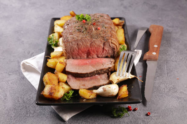 istock roasted beef fillet with potato and garlic 1196422496