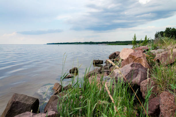 istock stones by the pond, beautiful summer landscape 1196423301