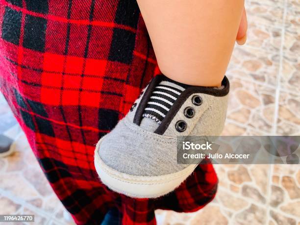 Teni Baby Shoe In Gray Without Laces Stock Photo - Download Image Now - 20-29 Years, Adult, Arts Culture and Entertainment