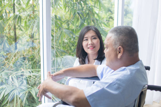 istock nurse smiled and take care patient 1196432066