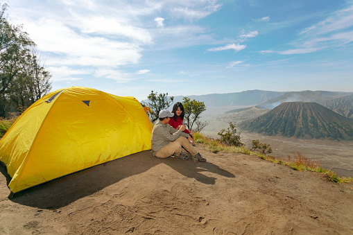 Two couples  doing camping activities in Bromo Mountain, East Jawa, Indonesia