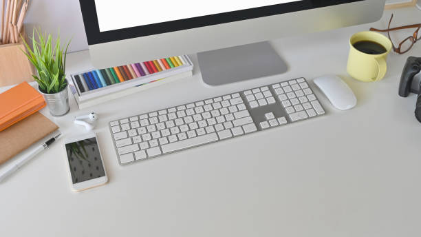 istock creative workspace. equipment and the computer on the white working desk 1196442881