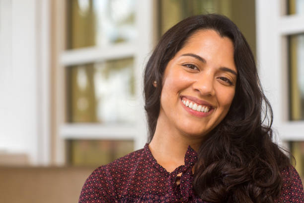 istock Young Hispanic woman smiling. 1196443052