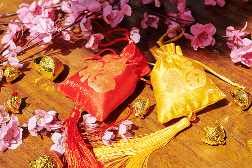 Red and golden ornate fabric bags for Chinese New Year celebration