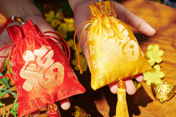 Red and golden textile bags with best wishes embroidery as gifts for spring festival