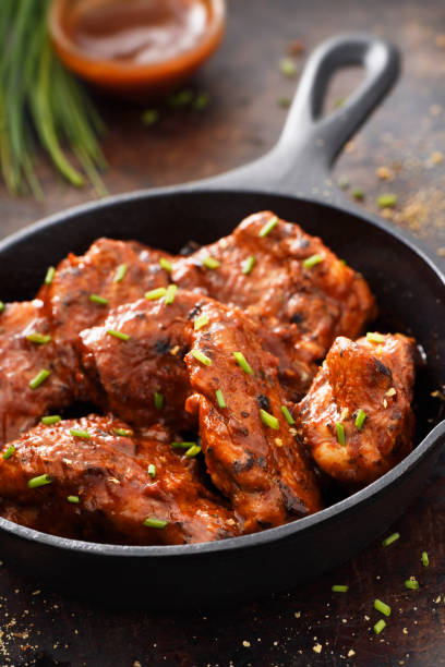 istock Chiken wings in a skillet 1196452279