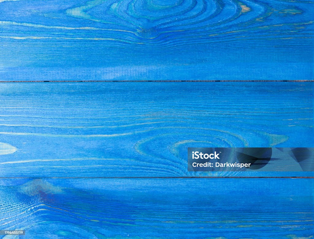 Wooden Board painted by blue paint. The texture of the wood, where you want to copy. Template subtext Abstract Stock Photo