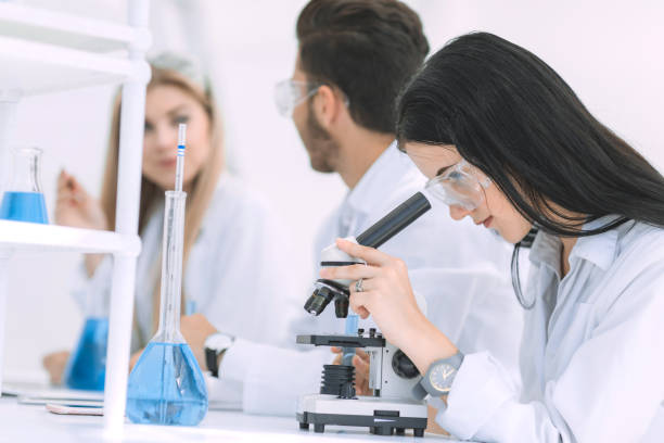 istock female scientist uses a microscope in the laboratory 1196456681