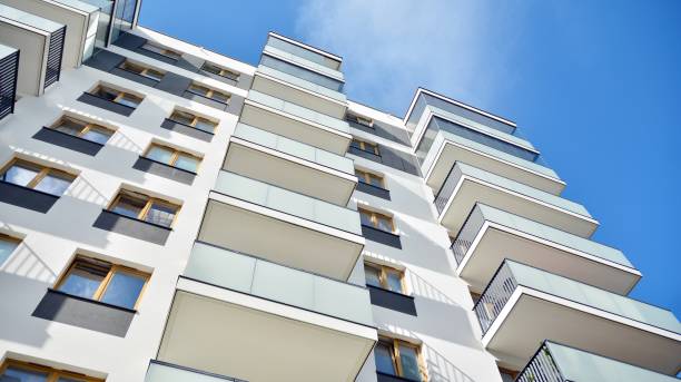 istock Multistory new modern apartment building. 1196464140
