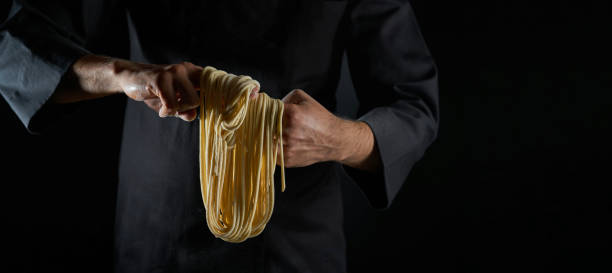 istock Male Chef Cooking Homemade Noodles Hand Pulled Noodles 1196474425