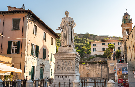 Pietrasanta, Tuscany, Italy - July 5, 2019: Marble statue on a pedestal to Leopoldo II in main square of Pietrasanta, Tuscany, Italy