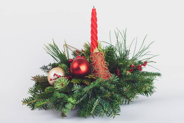 istock natural table Christmas decoration with candle on white background 1196477062